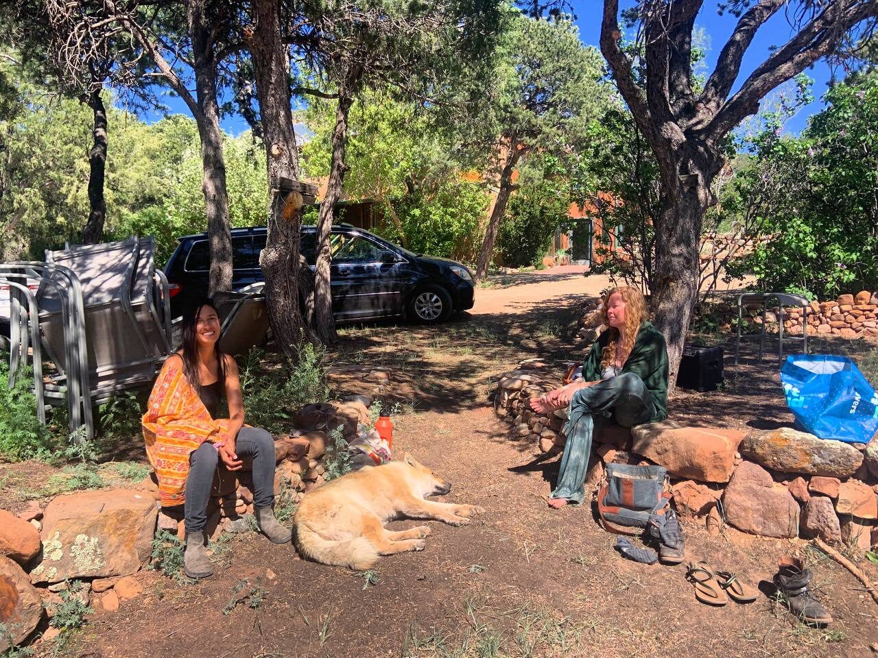 Community members resting in the shade at Wo-Man-I-Fest 2023